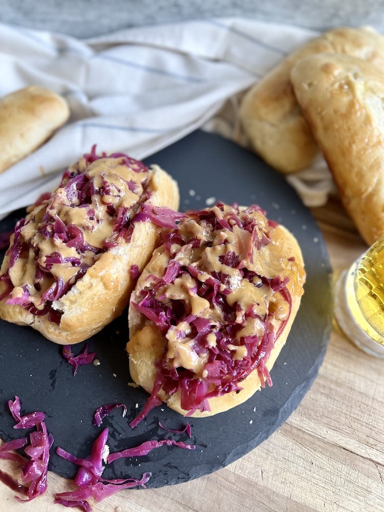 Grilled Beer Brats with Red Cabbage Kraut on buns