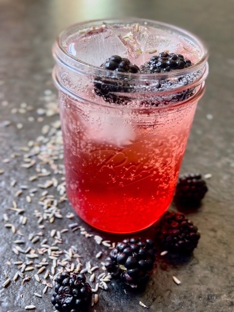 Lavender Blackberry Shrub in a glass of soda water
