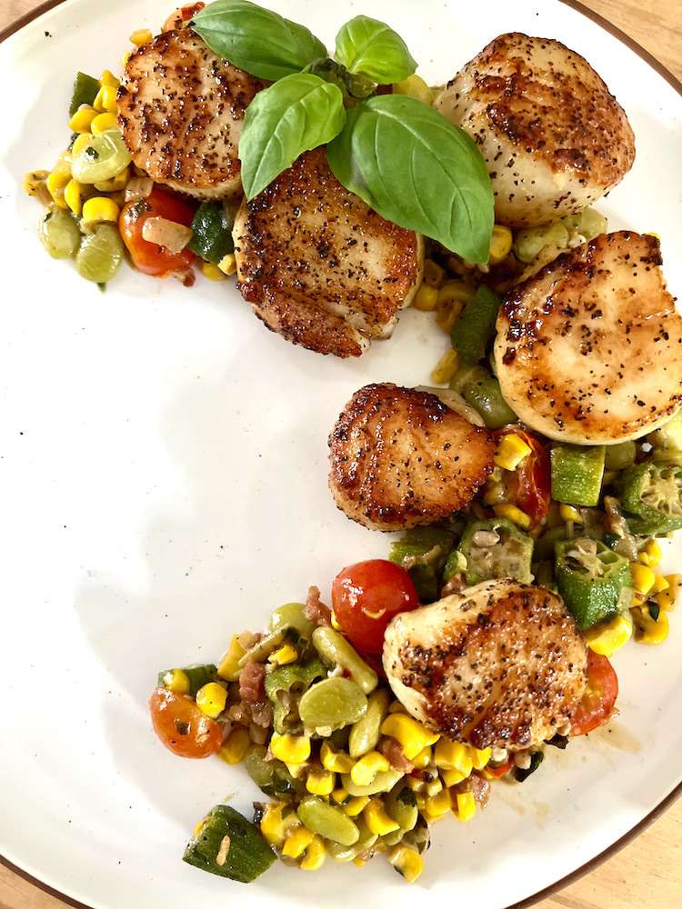 Pan Seared Scallops and Succotash on a plate