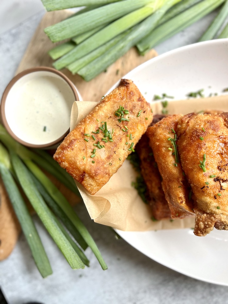 Buffalo Chicken Eggs Rolls on a plate with ranch dressing