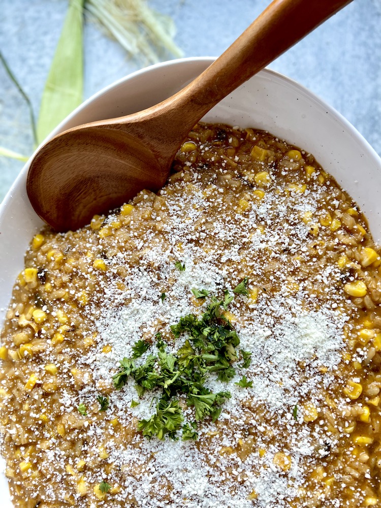 Poblano Corn Risotto in a serving dish with serving spoon