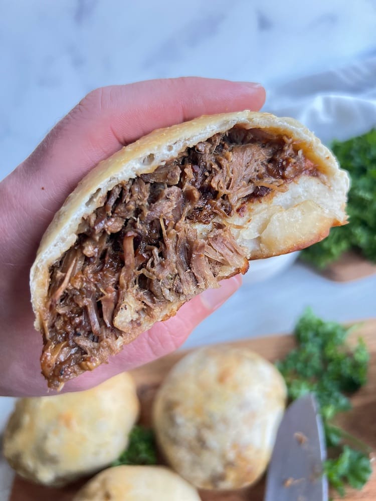 An Irish Stew Stuffed Roll cut in half and shown to the camera