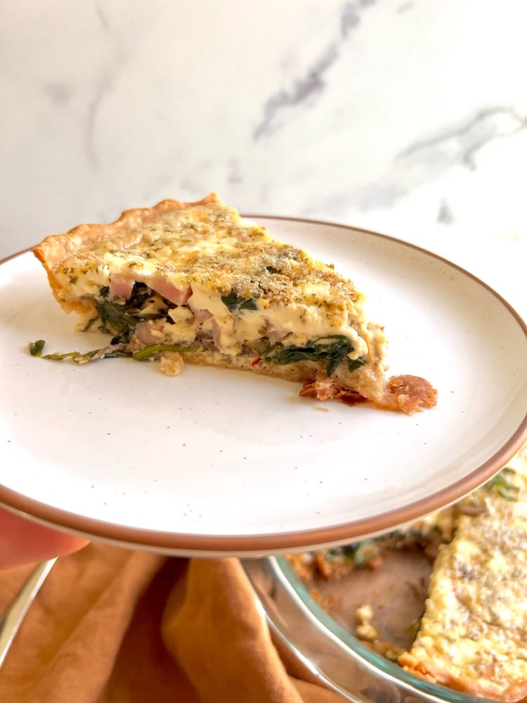 A slice of Greek Easter Quiche on a plate