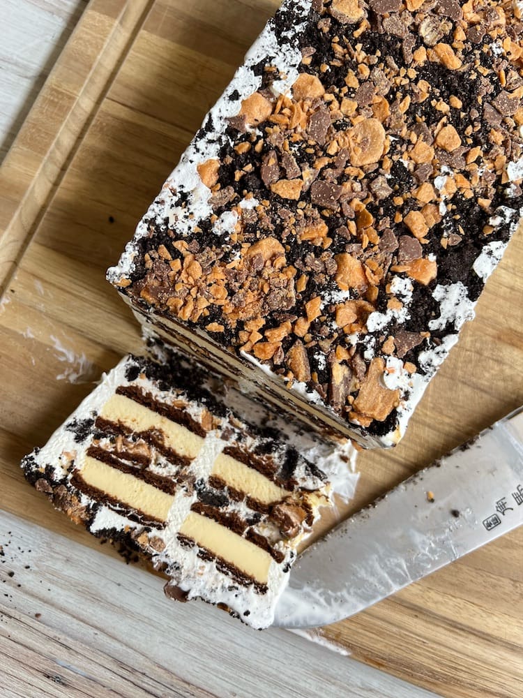 Ice Cream Sandwich Cake viewed from above with one slice laying down