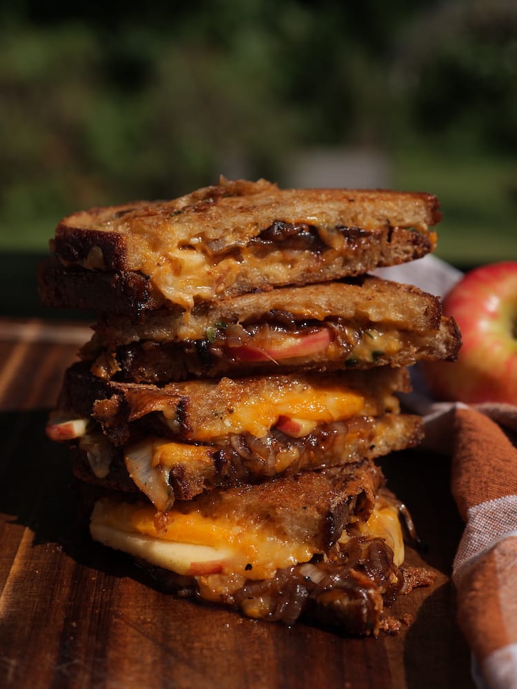 Pieces of Hangry Apple Grilled Cheese stacked on top of each other