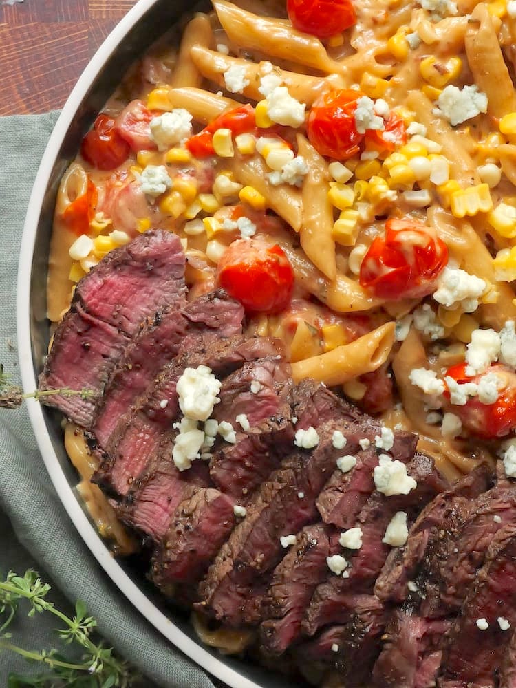 Steak Gorgonzola Alfredo in a large circular serving dish