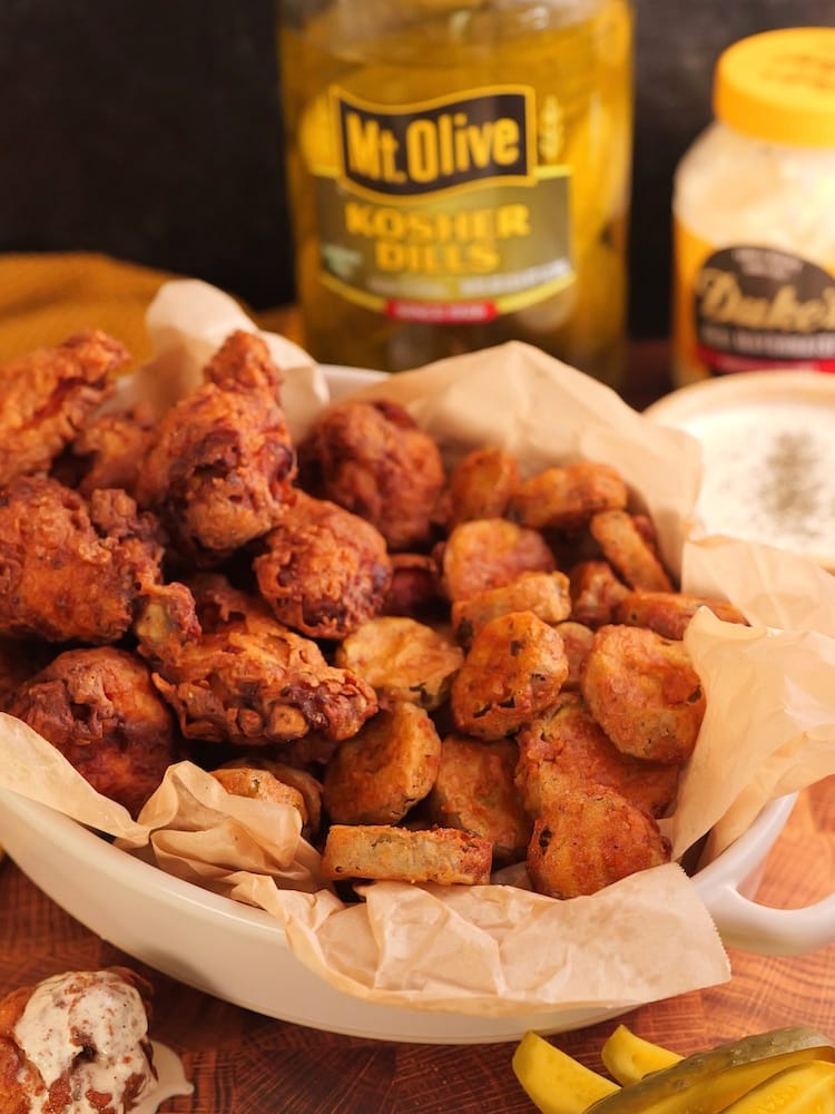 Fricken Wings & Frickles in a serving basket with Mt Olive Pickles & Duke's Mayonnaise in the background