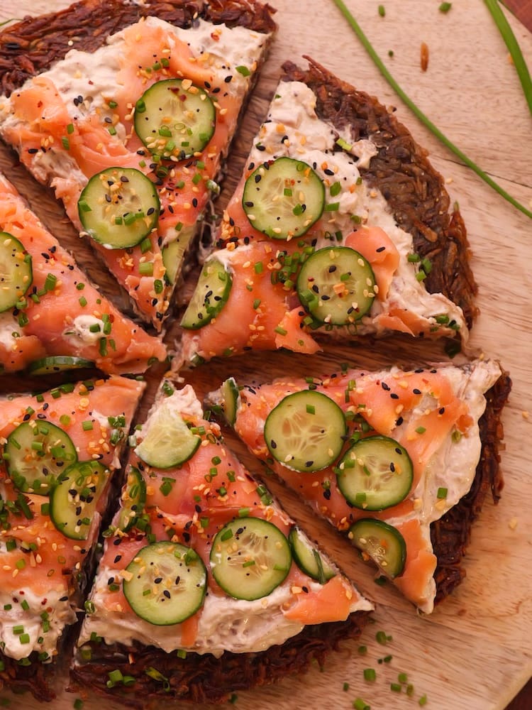 Sliced Smoked Salmon Rosti on a wooden cutting board